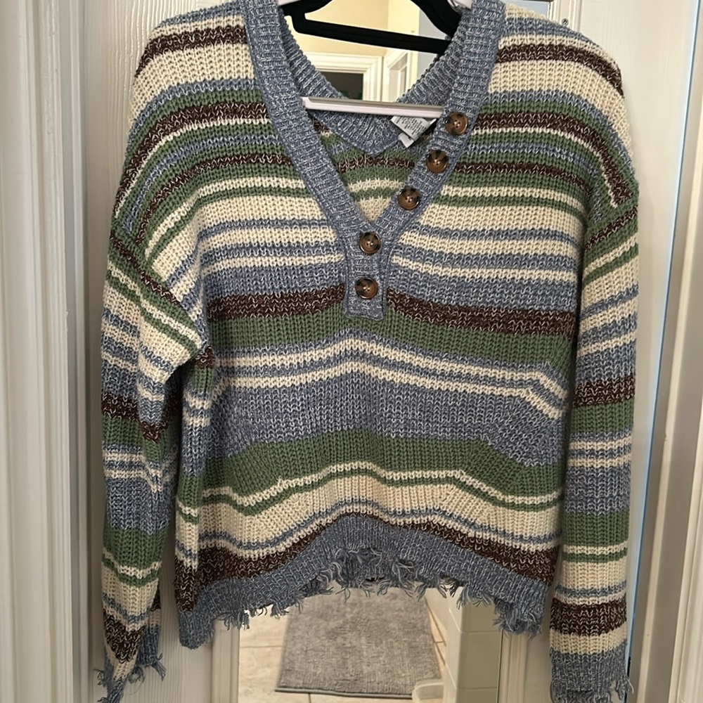 V-neck distressed bottom sweater